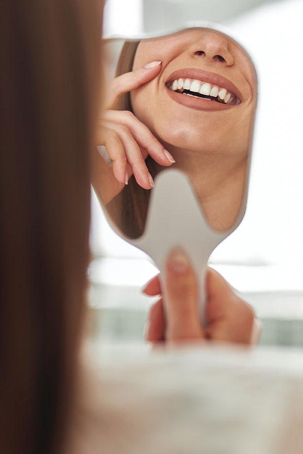 Patient checking her smile
